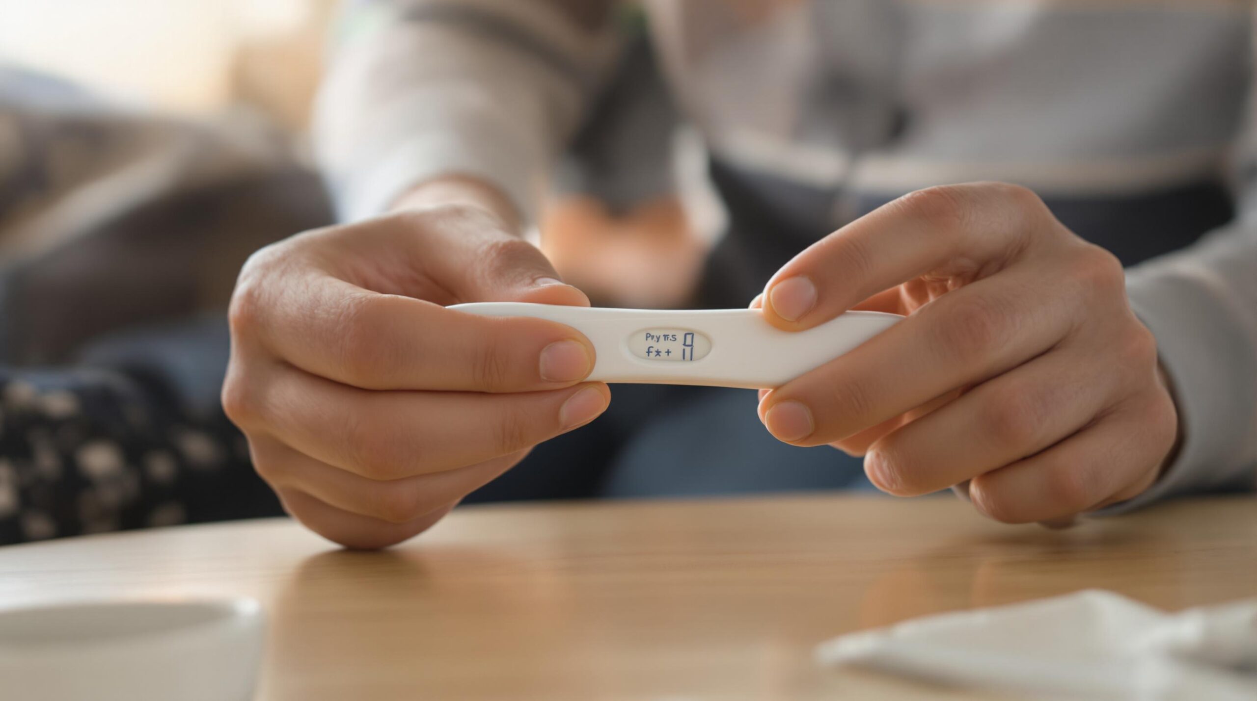 Positive pregnancy test in hands